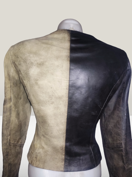 Back of a leather jacket with left side cleaned and left side worn