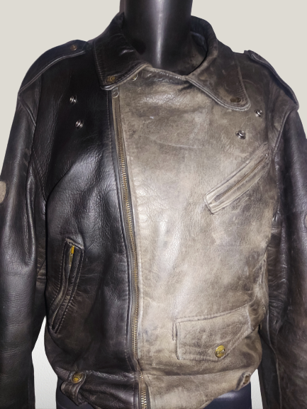 Front of a leather jacket with right side cleaned and left side worn